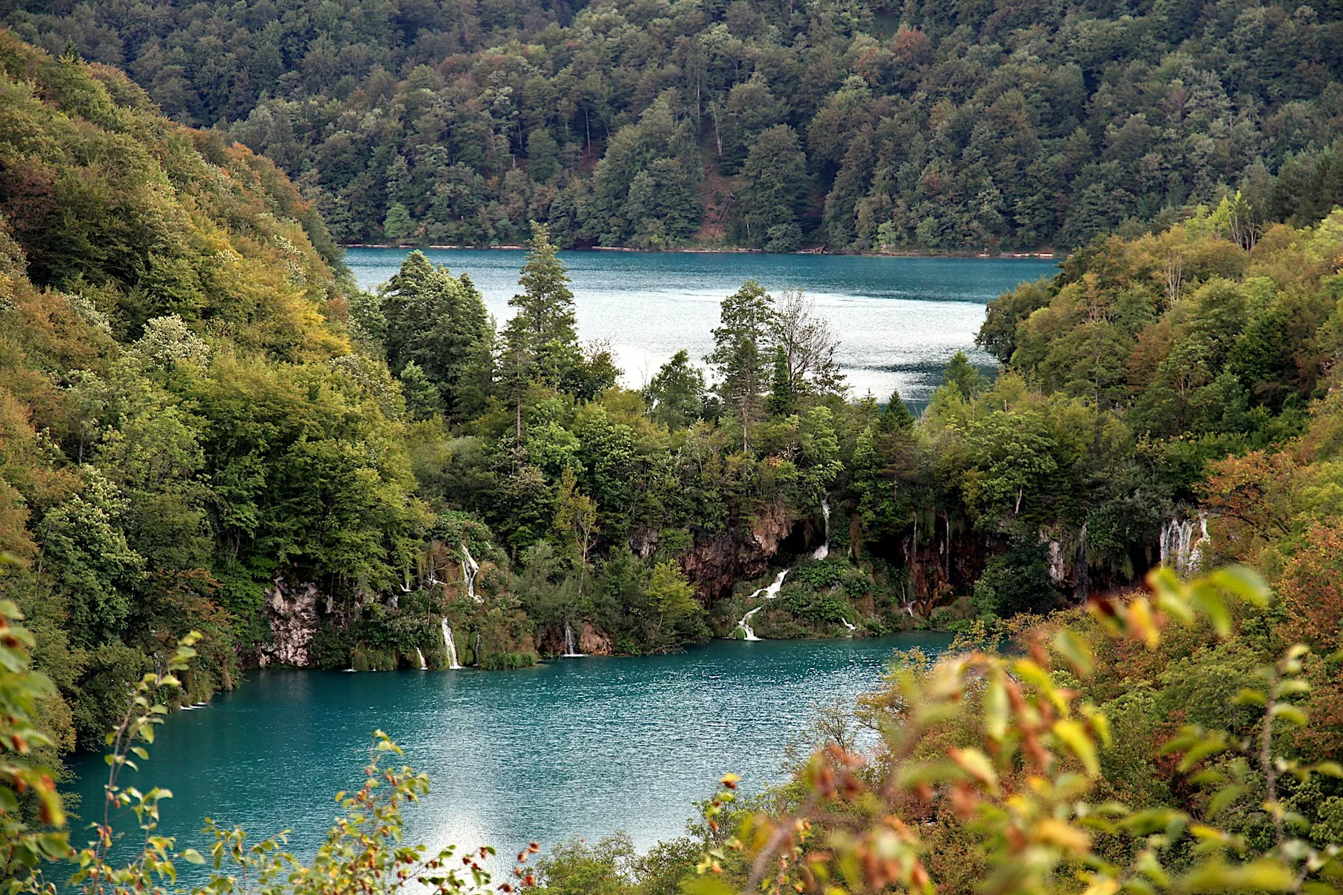 Turquoise lake and autumn forest at Plitvice Lakes on a day trip from Šibenik